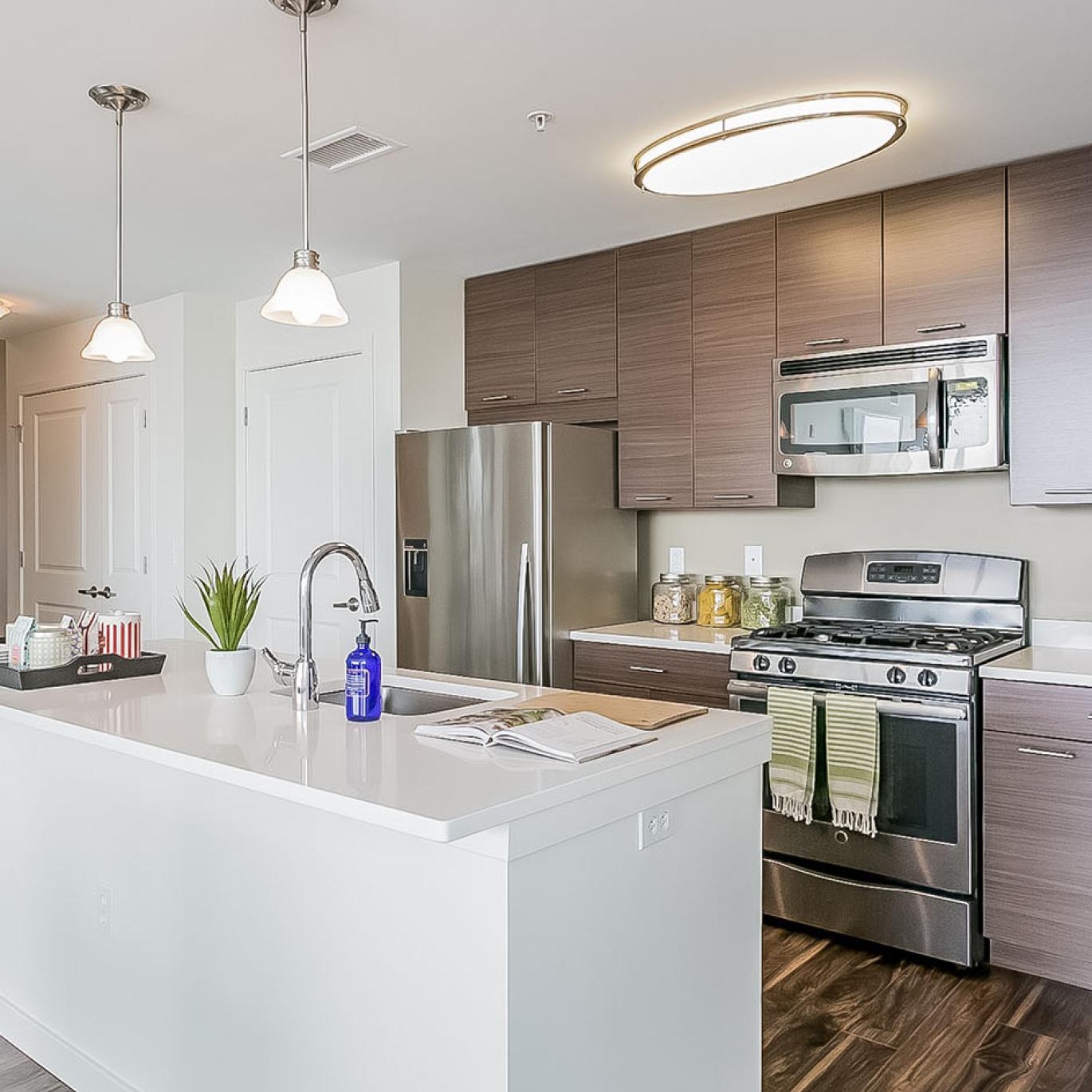 a kitchen with a white counter top
