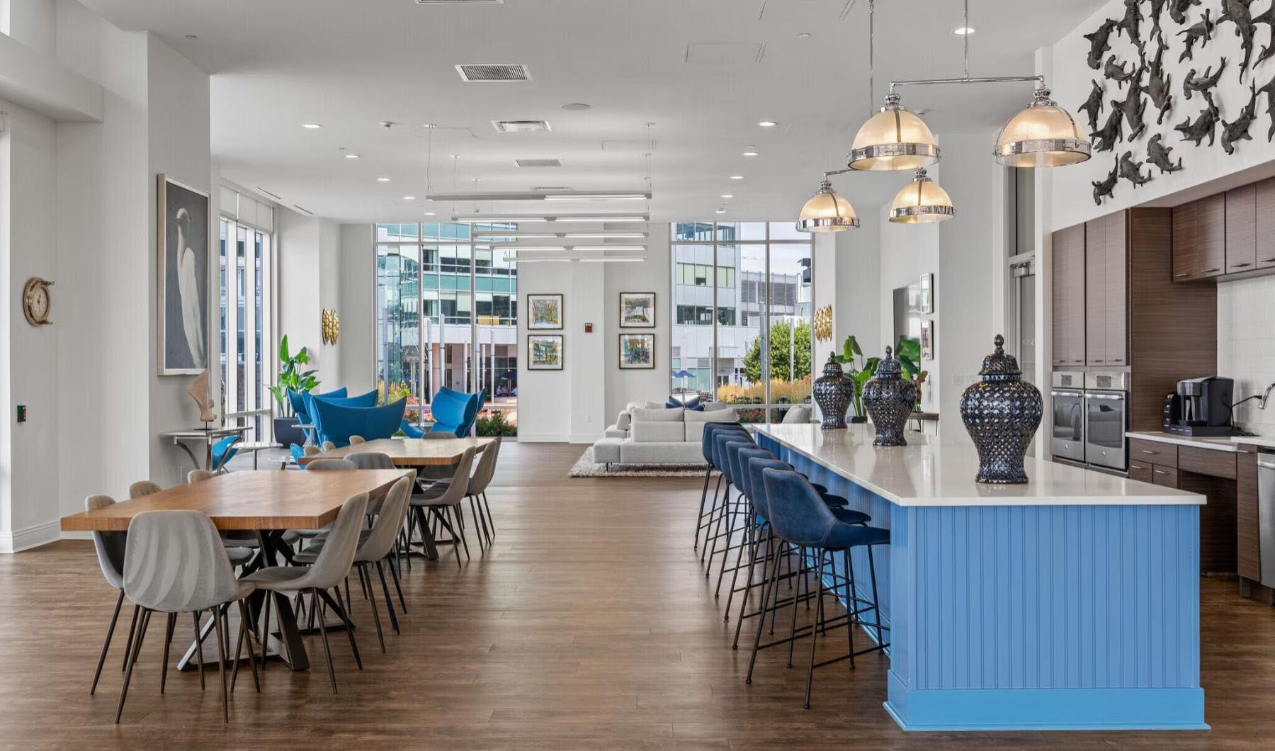 a clubroom with tables and chairs